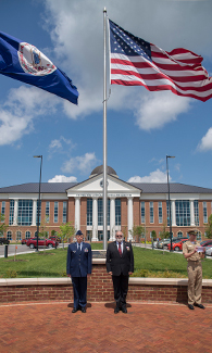 LUCOM student-doctor Zack Jensen recognized in front of Center for Medical and Health Sciences.