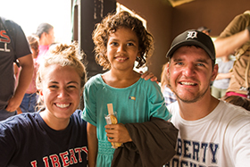 LUCOM student-doctor Joshua Reynolds, 2018, pictured with a child from Zacapa, Guatemala.