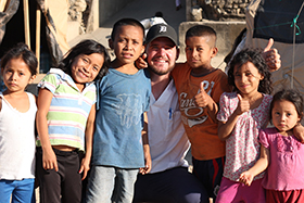 LUCOM student-doctor Joshua Reynolds, 2018, pictured with children from Zacapa, Guatemala.