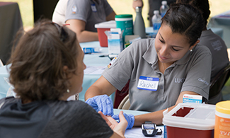 LUCOM student-doctor at HEALTHFEST