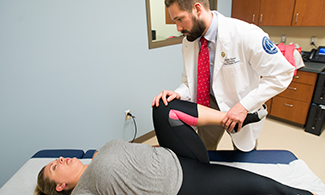 Patient Anne Marie Jones receives treatment for back pain.