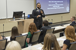 Troy Burnett, associate director of Student Services, leads orientation session.