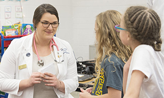 LUCOM-Student Osteopathic Medical Association visits Tomahawk Elementary School.