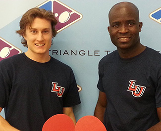 Messanh Ameduite (right) poses with team member at recent competition.