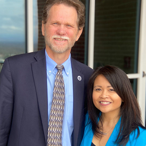 LUCOM Dean Peter Bell, DO, and Nanette Lacuesta, MD, pictured outside Liberty University's Center for Medical and Health Sciences.