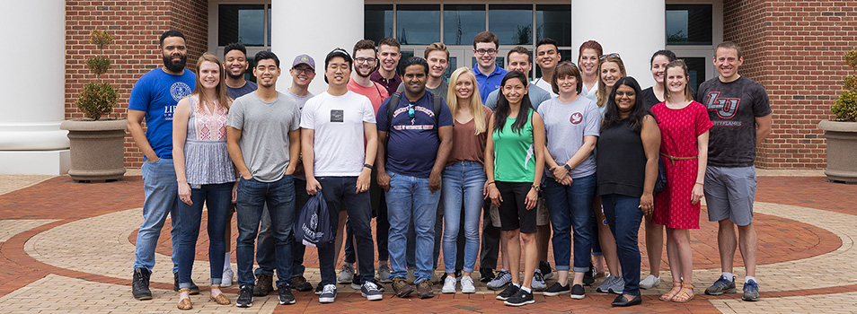 LUCOM Office of Students pictured with Liberty osteopathic medical students outside the Center for Medical and Health Sciences.