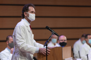 Peter A. Bell, DO, dean of LUCOM, explains the tradition of the White Coat Ceremony.