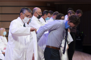 Liberty University osteopathic medical students, Class of 2024, are coated during LUCOM's seventh White Coat Ceremony.