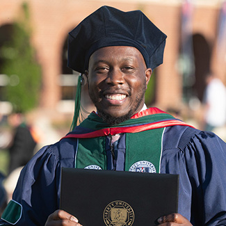 LUCOM Class of 2021 graduate pictured on the Academic Lawn of Liberty University on May 14, 2021.