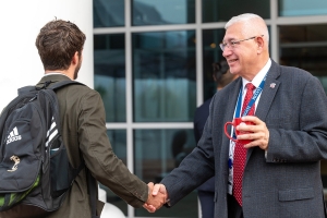 Joseph R. Johnson, DO, FACOOG (Dist), dean and professor of obstetrics and gynecology of Liberty University College of Osteopathic Medicine, greets a new Liberty University osteopathic medicine student.