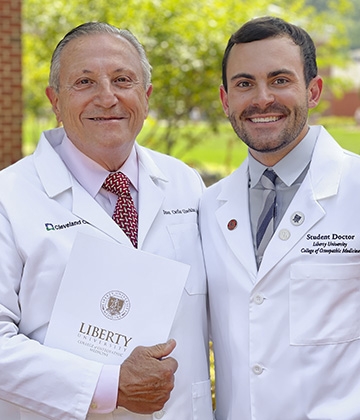 LUCOM student-doctor Brenner Johnson pictured with his grandfather Juan Carlos Giachino, Sr., MD.