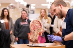 Liberty University second-year osteopathic medical student Daniel Daugherty demonstrates anatomical dissection during "Operation Sparky."