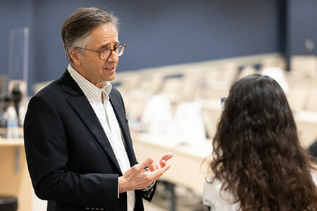 Dr. James Avery encourages a LUCOM student-doctor following his presentation on March 1, 2022.