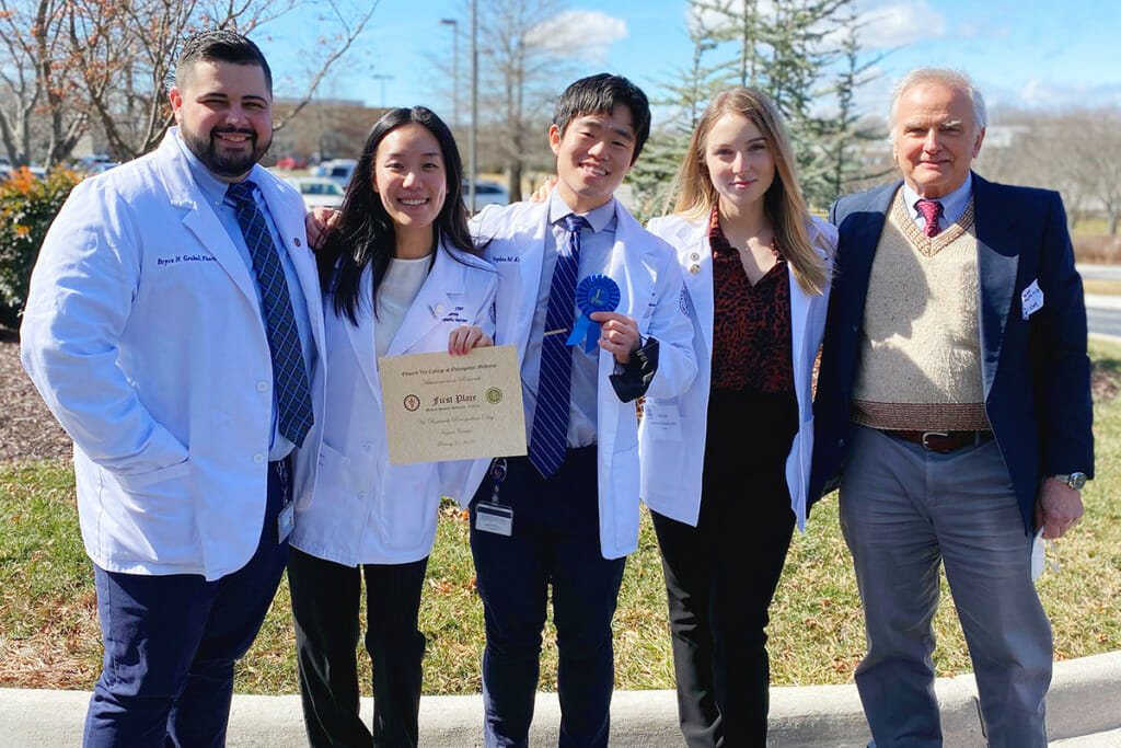 Liberty University osteopathic medical students Bryce Grohol (Class of 2024), Jubin Kang (Class of 2025), Stephan Kim and Marija Zivcevska (Class of 2024), pictured alongside Charles R. Joseph, MD, assistant professor of neurology; awarded First Place in the Medical Student Research (Clinical) category at the annual Edward Via College of Osteopathic Medicine (VCOM) Research Recognition Day, Feb. 25.