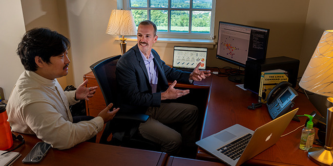 LUCOM Research Fellow Harold Shin, Class of 2025, reviews epidemiologic datasets with Nicholas Rider, DO.