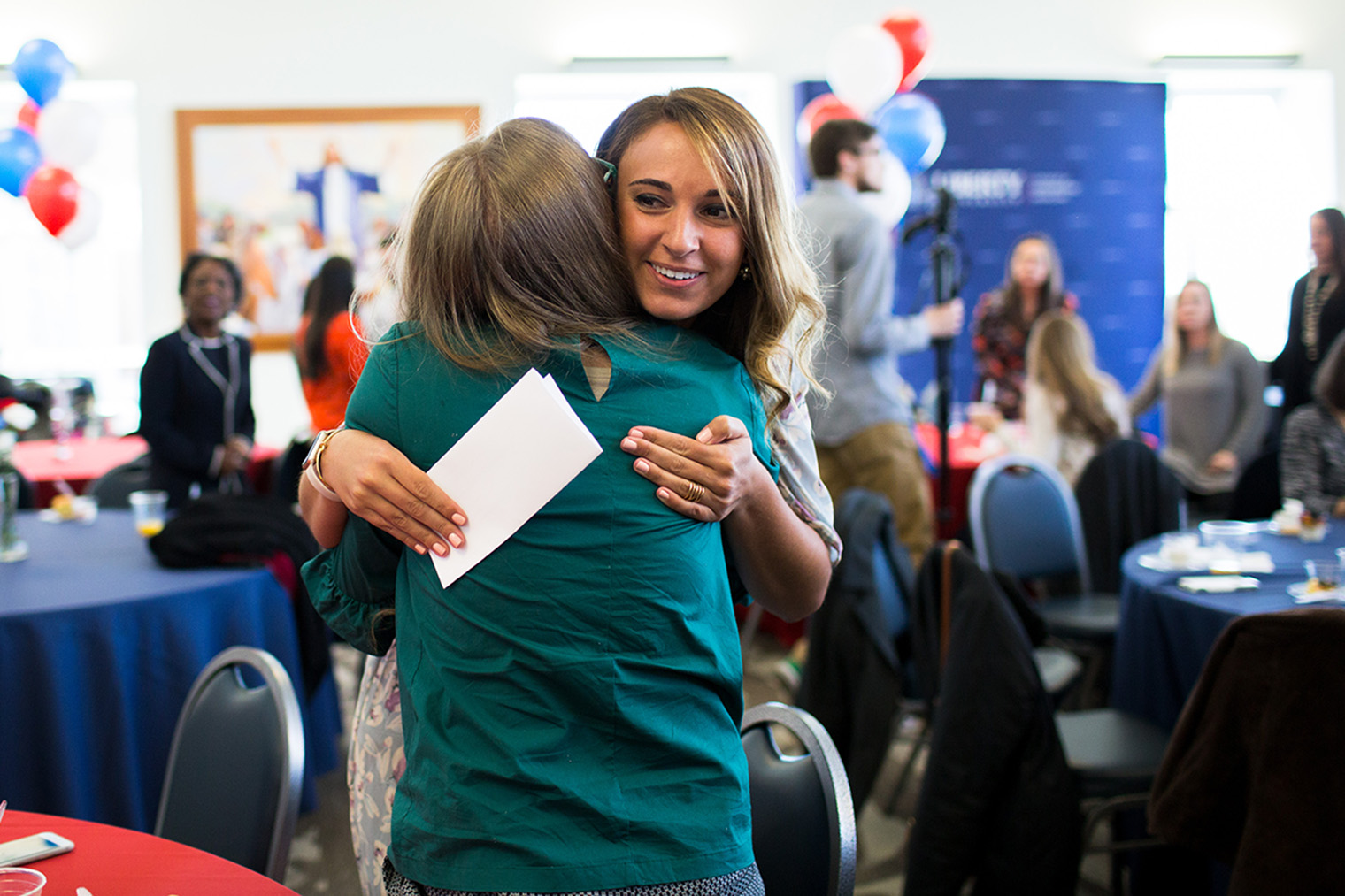 Kiersten Pikarsky hugs Kindra Galloway after receiving their placements. (Photo by Leah Seavers)