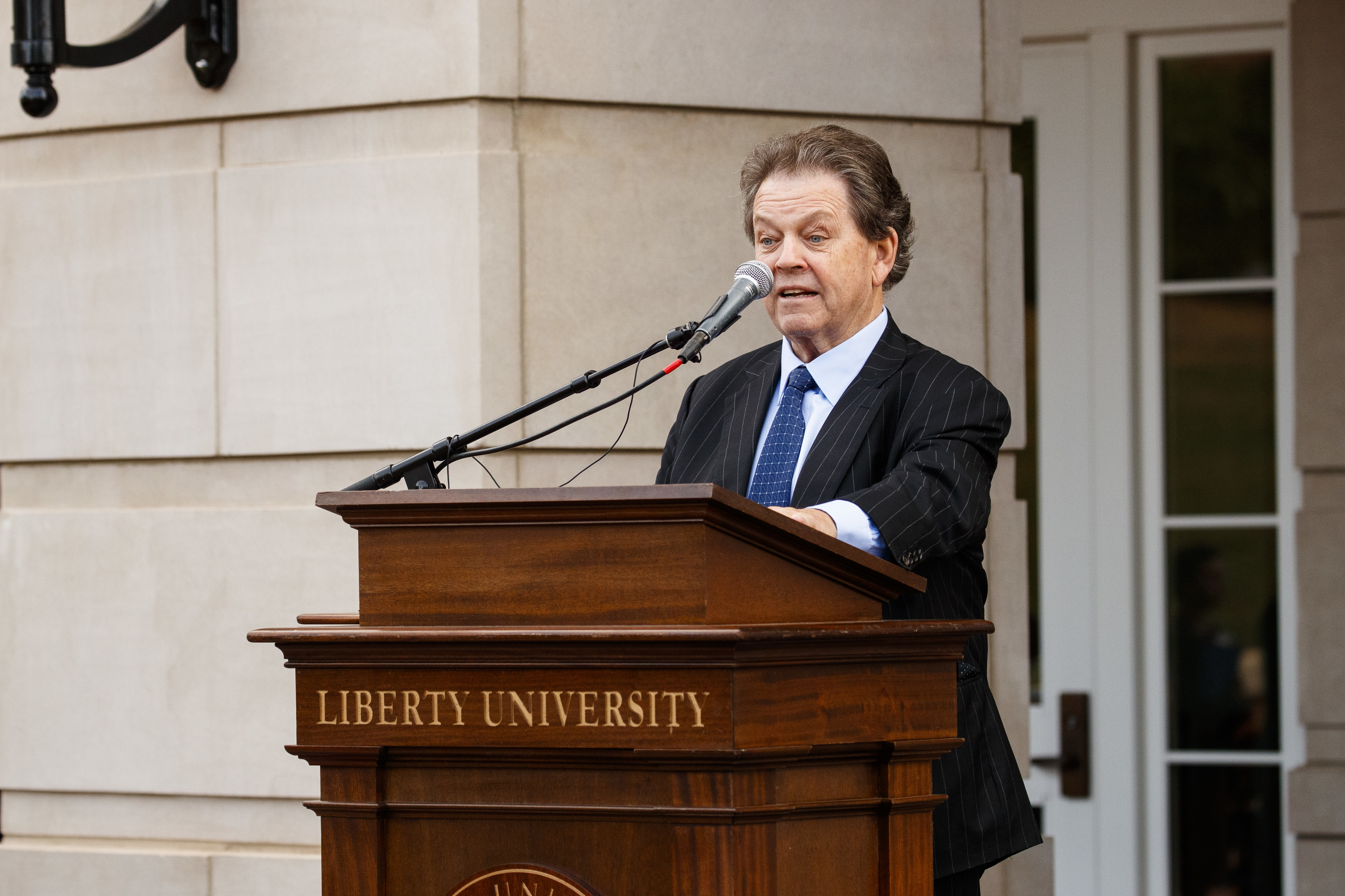 Art Laffer speaks at the ribbon-cutting ceremony in front of the School of Business on Wednesday morning.