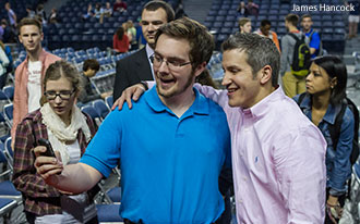 Jon Acuff poses for a selfie with a Liberty University student.