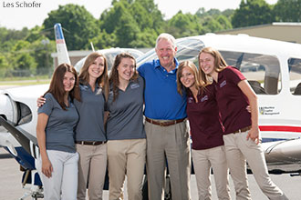 Dave Young, Dean of the Liberty School of Aeronautics, with the Liberty Belles.