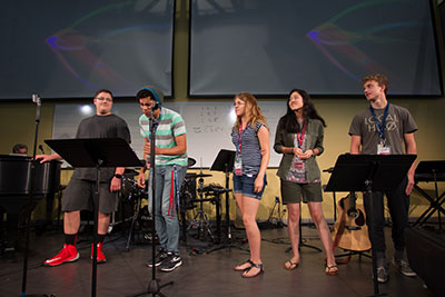 Choir members sing during a breakout session in the Music and Worship Camp. 