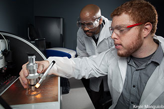 Computer engineering students working in a lab.