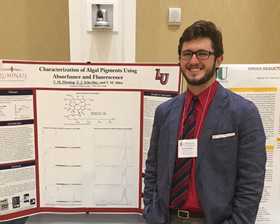 Recent Liberty University graduate Conner Fleming presents his research poster at the Virginia Academy of Science Annual Meeting.