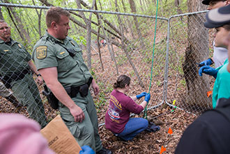 Deep in the woods between yellow tape and teams of professional investigators, 40 Liberty University students gathered together to participate in a simulated crime scene Friday at the Outdoor Recreational Center at Hydaway.
