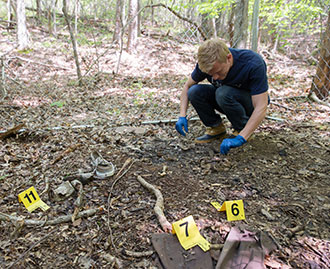 Deep in the woods between yellow tape and teams of professional investigators, 40 Liberty University students gathered together to participate in a simulated crime scene Friday at the Outdoor Recreational Center at Hydaway.