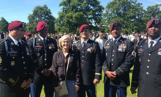 Liberty graduate Ashley Sears with a group of U.S. soldiers.