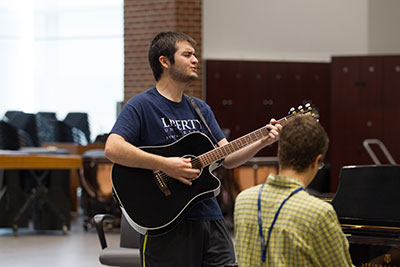 Guitar and piano players rehearse during the School of Music's Music and Worship Camp.