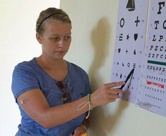 Sadie Plasterer gives eye care services in Haiti.