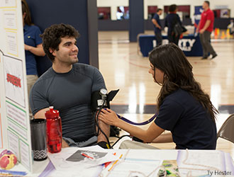 Liberty nursing student gives heart screening.