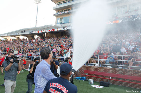 Liberty University President Jerry Falwell soaks the freshman class with a fire hose.