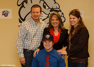 Josh Barrick and his family as he signs to play with the Liberty University baseball team.