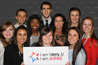 Liberty University Stand With Israel Club members pose with Penny Nance.