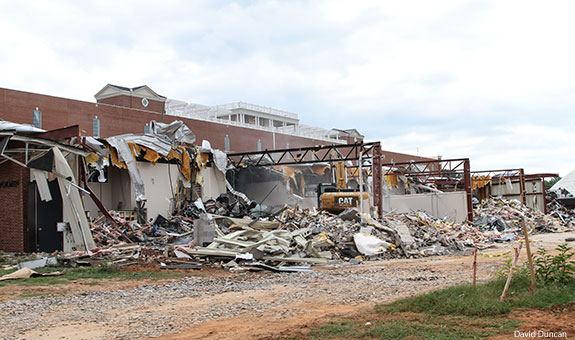 Demolition takes place behind Liberty University's DeMoss Hall.