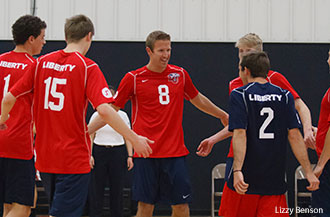 Liberty's men's volleyball team celebrates.