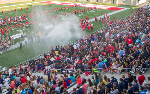 The freshman class is soaked with a fire hose by President Falwell.
