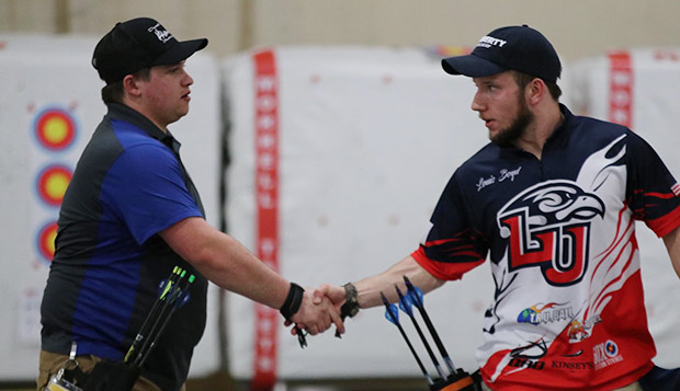 Liberty junior Louis Boyd (right) shakes the hand of Murray State's Brandon Shaw after winning the gold-medal match. (Submitted photo by Amy Skelton) 