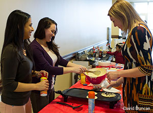 Liberty SOMA students serve pancakes as part of a fundraiser.