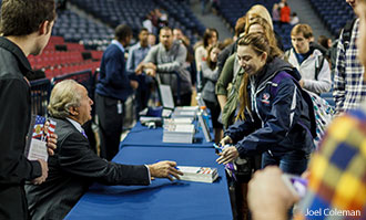Mike Reagan signs books for Liberty University students.