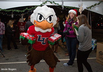 Sparky the Eagle, Liberty's mascot, poses with a student participant in the OCC LU Blitz.