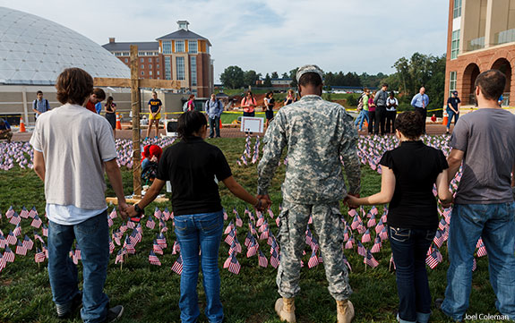 Liberty University students and staff, in recognition of 9/11, join hands to pray for their country and the victims' families.