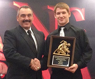 Liberty freshman Ryan Diehl receives the NCWA wrestler of the year award.