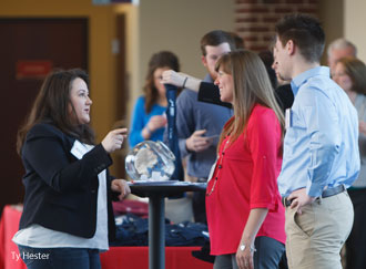 Law school staff greet alumni at a breakfast reception on Saturday, March 22.