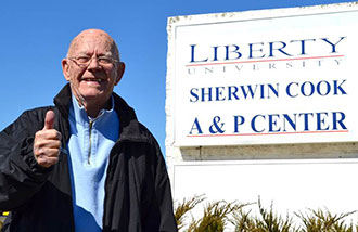 Sherwin Cook outside the newly named Liberty University Sherwin Cook A&P Center.