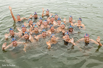 Liberty University's women's swim team waves in the lake at the Falwell family farm.