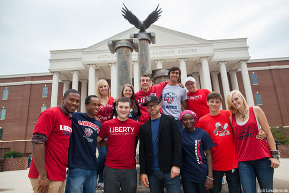 Liberty University students with alumnus TobyMac in front of DeMoss