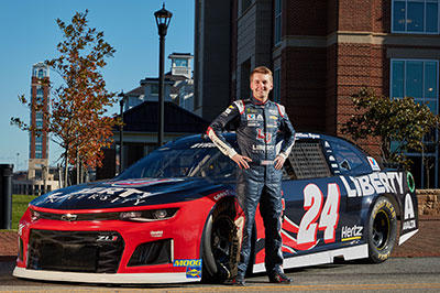 William Byron, who is studying business communications at Liberty, showcases his Liberty University No. 24 Chevrolet Camaro ZL1 during a visit to campus on Oct. 24. (Photo by Joel Coleman)