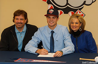 Zach Clinton and his parents as he signs to play with the Liberty University baseball team.